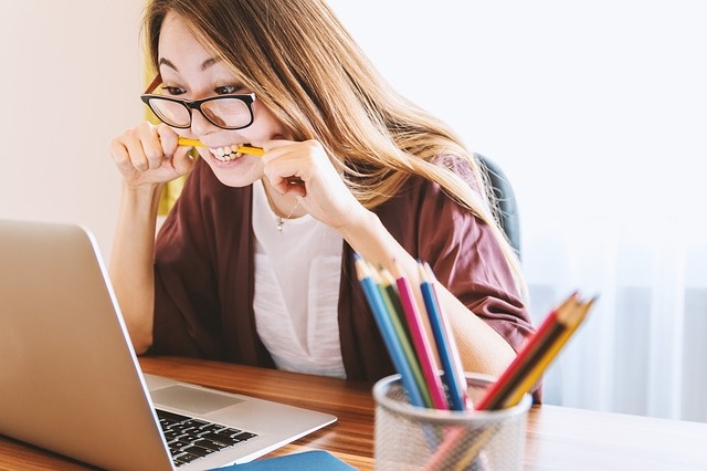 Image of female student looking at laptop