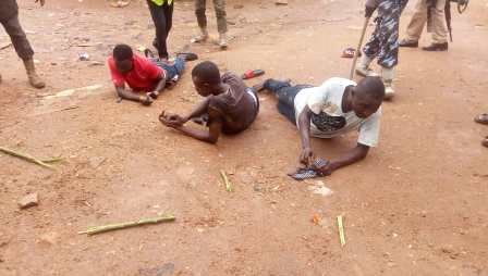 Pictures of the man arrested by police for possessing clone cards and others arrested for wandering around polling zone.