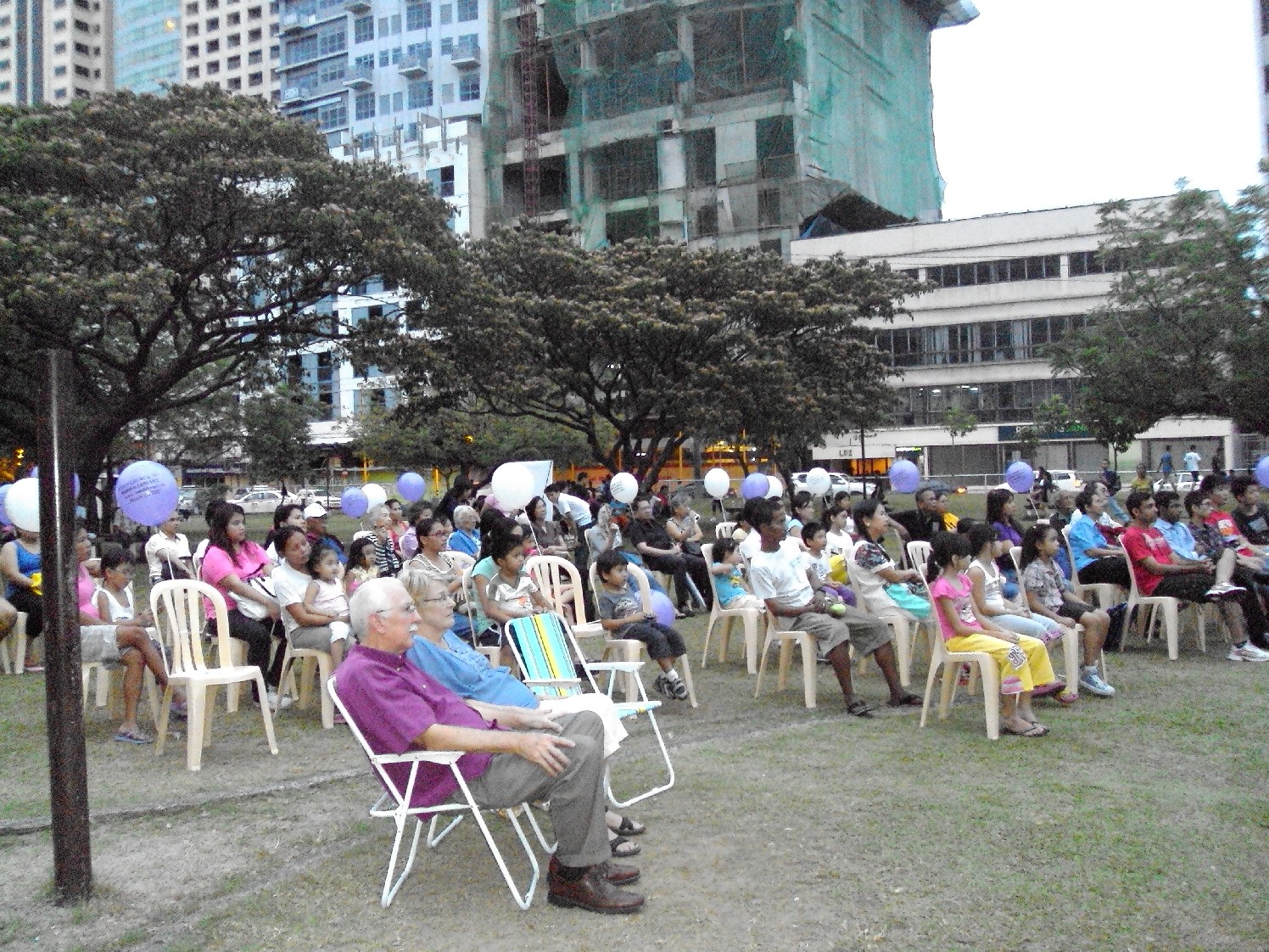 adults attending library program outside 