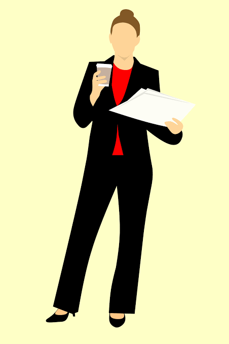 Woman in a business suit with coffee and papers